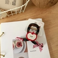 Detail view of tortoiseshell apple hair clip with red ribbon on white card - Brown Apple Plaid Bow Claw