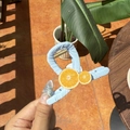 Light blue fabric hair claw clip featuring decorative orange fruit slices for women - Orange Sea Salt Blue Claw Clip