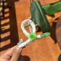 Cream satin hair clip featuring a green apple charm and green apple logo detail - Apple Light Green Claw Clip