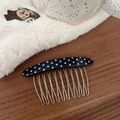 Detailed view of the black polka dot acetate hair comb with ten silver metal teeth - Black White Polka Dot