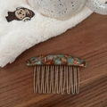 Detail of handmade tortoiseshell pattern acetate hair comb with ten silver metal teeth - Brown Green Marble