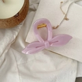 Pince à cheveux rose en forme de nœud avec ressort doré sur fond de tissu élégant - Violet Clair