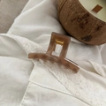 Detail of a 5cm rectangular tortoise shell hair claw clip with golden spring on lace - 5.2cm / Transparent Brown