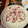Elegant satin scrunchie with red tomato and polka dot prints in a ceramic bowl - Tomato Orchard Polka Dot Scrunchie