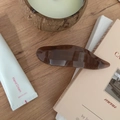 Detail of a 11.5cm dark brown resin hair claw clip with a glossy amber texture - 11.5CM / Transparent Brown
