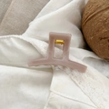 Detail of dusty pink matte hair claw clip with golden spring on white lace fabric - 5.2cm / Light Nude Pink