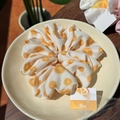Elegant white satin scrunchie with orange citrus print and Alline brand tag in a dish - Orange Orchard Moonlight White Scrunchie