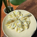 Satin scrunchie with lemon fruit pattern and yellow-green summer floral design - Lemon Orchard Moonlight White Scrunchie