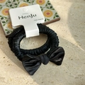 Detail of elegant black satin bow hair scrunchies on white display card with sunlight - Ruched Satin with Card / Black