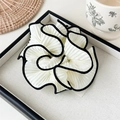 Detailed view of large pleated beige hair scrunchie with black contrast piping on edge - Pleated Contrast Scrunchie / Black