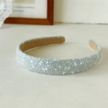 Detailed close-up of sparkling silver sequin headband with soft velvet non-slip lining - Glitter Light Gray