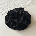 Detailed close-up of a black scrunchie with white polka dots and layered floral pleats - Small Polka Dot Black