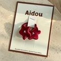 Detail of red velvet star hair ties with white pearls and silver beads on a display card - Red Hair Tie