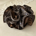 Brown floral scrunchie hair tie with delicate blue and yellow pattern detailing - Coffee