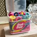 Detailed view of colorful elastic hair ties in a transparent box with MSMP kids branding - Rose Blue