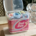 Macro shot of colorful macaque high-elasticity hair ties in a transparent box packaging - Light Pink
