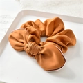 Detail of silk bow hair scrunchie in bronze with stylish tricolor striped edge - Orange
