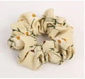 Light yellow floral chiffon scrunchie with daisy pattern for elegant hair styling - Flower Beige