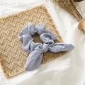 Detail of blue and white striped scrunchie with bunny ear bow on a woven mat - Rabbit Ear / Light Blue