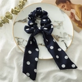 Close-up of dark blue polka dot hair scrunchie with long ribbons on marble tray - Navy Blue Polka Dot