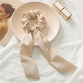 Detailed texture of beige vertical striped fabric on hair scrunchie with long ribbons - Khaki Ribbed
