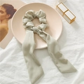 Detail of light green ribbon scrunchie featuring a premium ribbed texture fabric - Light Green Ribbed