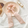 Detail showing pink chiffon scrunchie with vertical texture and long ribbons on a tray - Korean Pink Ribbed