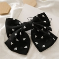 Elegant black chiffon hair clip with white heart prints in a large bow design - Black with Small Heart