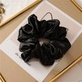 Elegant black satin scrunchie with pleated texture on a vintage cat frame display - Oversized Black Scrunchie