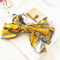 Elegante pasador de lazo en satén amarillo con patrones de cadenas vintage retro - Cadena Amarilla