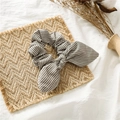 Grey and white striped scrunchie with rabbit ear bow on a natural woven mat background - Rabbit Ear / Light Coffee