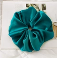 Detail view of large peacock blue satin hair scrunchie with elegant silk texture - Dark Green
