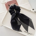 Elegant navy blue chiffon scrunchie with long ribbons on a white display tray - Black