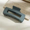 Macro detail of blue-gray rectangular matte hair claw clip on stone surface - Matte Blue