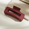 Macro detail of large burgundy matte hair claw clip on natural stone background - Matte Wine Red