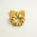 Detail view of yellow plaid scrunchie with cute cat ear design and elastic fabric - Yellow