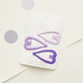 Dettaglio di tre fermagli per capelli a forma di cuore opaco in sfumature viola - Set a Forma di Cuore
