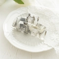 Detailed macro view of square acrylic hair claw with grey marble texture and glitter - Hollow Gray White