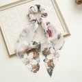 Detail of floral chiffon scrunchie with long ribbon streamers and vintage flower print - Ink Style Floral