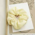 Chic cream yellow pleated scrunchie hair tie with soft fabric texture and elastic design - Yellow