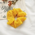 Yellow seersucker scrunchie with plaid texture and small decorative 3D pompoms - Swiss Dot Ginger