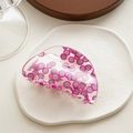 Macro detail of acrylic hair claw clip featuring bright dragon fruit pattern on white surface - Half Round Kiwi