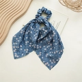 Detail of blue ponytail bow scrunchie with white dandelion print and long streamers - Dandelion Blue