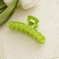 Detailed view of candy green water-ripple chain hair claw with polished gold spring - Green