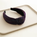 Macro detail of the knot design and textured metallic purple fabric on the wide headband - Glitter Purple