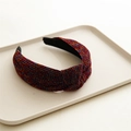 Close-up of pink glitter knotted headband with shimmering metallic fabric texture - Glitter Wine Red
