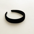 Close-up detail of soft black velvet sponge headband showing plush texture and padded edge - Black