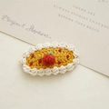 Handmade knitted yellow oval hair clip with cute red crochet fruit and white trim - Yellow Cake
