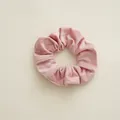 Detailed view of pink corduroy scrunchie showing soft ribbed velvet fabric texture - Thick Pink