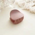 Close-up of matte pink claw clip with smooth frosted finish and rounded crescent design - Matte Pink